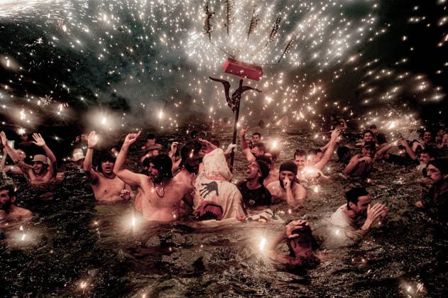 August 15, 2026, Badalona, Spain: People react in the sea as a Correfoc devil sprays fireworks over them during the August Festival in Badalona, north of Barcelona The Correfoc, a traditional Catalan celebration featuring fire-spitting performers, ends in the waters of Badalona beach. Badalona Spain - ZUMAb137 20260815_fap_b137_004 Copyright: xJordixBoixareux