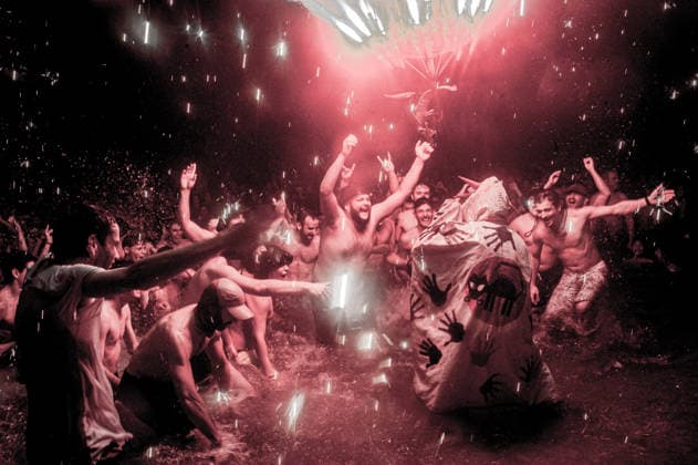August 15, 2026, Badalona, Spain: People react as a Correfoc devil enters the sea during the August Festival in Badalona, north of Barcelona. The Correfoc, a traditional Catalan celebration featuring fireworks and fire-spitting performers, ends in the waters of Badalona beach. Badalona Spain - ZUMAb137 20260815_fap_b137_017 Copyright: xJordixBoixareux