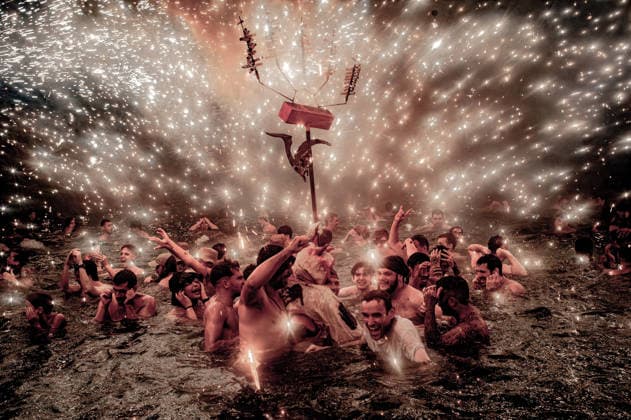 August 15, 2026, Badalona, Spain: People react in the sea as a Correfoc devil sprays fireworks over them during the August Festival in Badalona, north of Barcelona The Correfoc, a traditional Catalan celebration featuring fire-spitting performers, ends in the waters of Badalona beach. Badalona Spain - ZUMAb137 20260815_fap_b137_015 Copyright: xJordixBoixareux