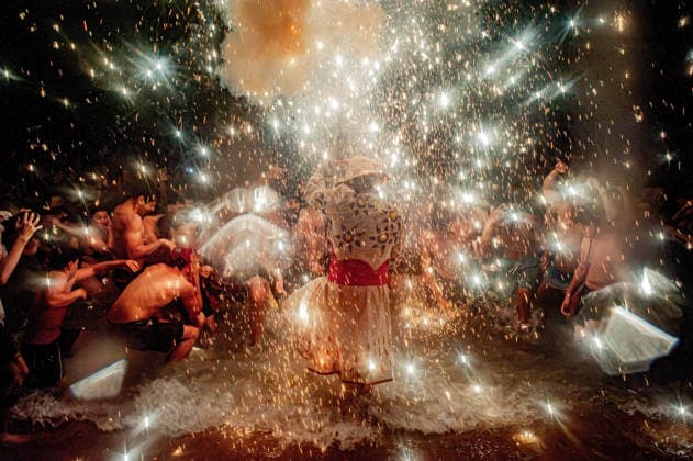 August 15, 2026, Badalona, Spain: People react as a Correfoc devil enters the sea during the August Festival in Badalona, north of Barcelona. The Correfoc, a traditional Catalan celebration featuring fireworks and fire-spitting performers, ends in the waters of Badalona beach. Badalona Spain - ZUMAb137 20260815_fap_b137_019 Copyright: xJordixBoixareux