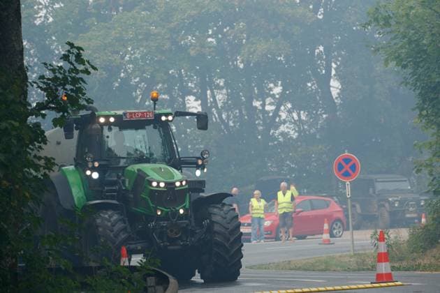 Farmer bringing water with a tractor a fire rages in the Hautes Fagnes (High Fens) nature reserve, on Sunday 16 August 2026 in Robertville. The fire started on August 14th and 2700 hectares (on a total of 4500) are impacted.  NICOLASxLAMBERT 183509380