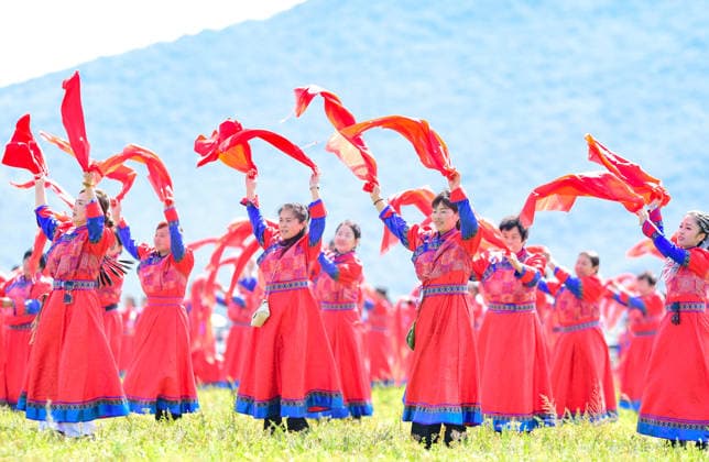 (260816) -- HINGGAN LEAGUE, Aug. 16, 2026 -- People perform at the opening ceremony of a Nadam fair in Jalaid Banner of Hinggan League, north China s Inner Mongolia Autonomous Region, Aug. 16, 2026. The Nadam fair opened here on Sunday, featuring equestrian performances, songs and dances, instrumental music and traditional folk performances. (Photo by Xinhua) CHINA-INNER MONGOLIA-NADAM FAIR (CN) WangxZheng 
