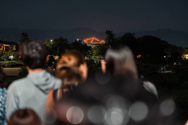 General view, August 16, 2026 - The Kyoto Gozan Okuribi or Five Mountain Bonfires, illuminate the night sky over Kyoto, Japan. The traditional summer observance marks the end of the Obon season, as five mountains surrounding the city are lit with bonfires to send ancestral spirits back to the afterlife.  aflo_341148125