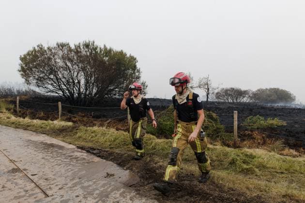 Emergency services pictured on the site, as a fire rages in the Hautes Fagnes (High Fens) nature reserve, on Sunday 16 August 2026 in Waimes. The fire started on August 14th and 2700 hectares (on a total of 4500) are impacted.  NICOLASxLAMBERT 183533011