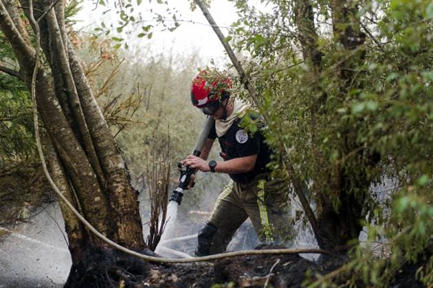 Firefighters in action on the scene of a fire rages in the Hautes Fagnes (High Fens) nature reserve, on Sunday 16 August 2026 in Waimes. The fire started on August 14th and 2700 hectares (on a total of 4500) are impacted.  NICOLASxLAMBERT 183533112