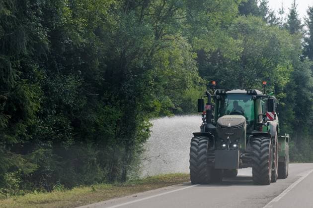 A tractor sprays water, as a fire rages in the Hautes Fagnes (High Fens) nature reserve, on Sunday 16 August 2026 in Waimes. The fire started on August 14th and 2700 hectares (on a total of 4500) are impacted.  NICOLASxLAMBERT 183533379