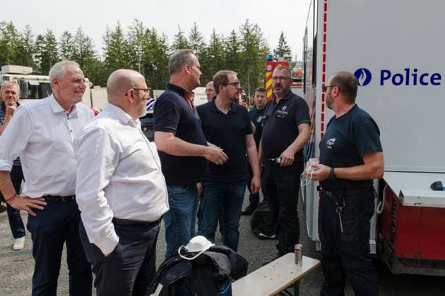 Liege province governor Herve Jamar (L), Interior Minister Bernard Quintin (2L) and German Community Minister President Oliver Paasch (C) visit the emergency services on site, as a fire rages in the Hautes Fagnes (High Fens) nature reserve, on Sunday 16 August 2026 in Waimes. The fire started on August 14th and 2700 hectares (on a total of 4500) are impacted.  NICOLASxLAMBERT 183533377
