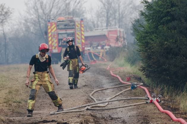 Firefighters in action on the scene of a fire rages in the Hautes Fagnes (High Fens) nature reserve, on Sunday 16 August 2026 in Waimes. The fire started on August 14th and 2700 hectares (on a total of 4500) are impacted.  NICOLASxLAMBERT 183534444