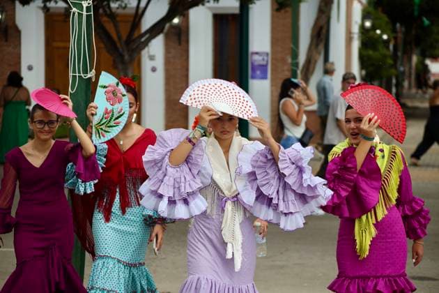 Scenes from the Málaga Fair: Several women dressed in flamenco gowns stroll through the Cortijo de Torres at the Málaga Fair. August 16, 2026, in Málaga, Andalusia, Spain. Locals and visitors enjoy the Málaga Fair at the fairgrounds. August 16, 2026, in Málaga, Andalusia, Málaga, Andalusia, Spain  Copyright: xÃlexxZeax 7716790