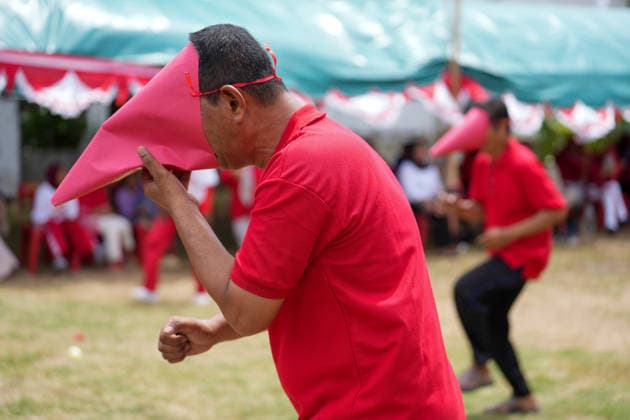 August 16, 2026, Banda Aceh, Aceh, Indonesia: Residents enthusiastically competed to gather balls while wearing paper-cone masks during a series of games held to celebrate Indonesia s 81st Independence Day in Banda Aceh, Aceh Province, Indonesia, on Sunday. This traditional contest, which restricts the participants field of vision, was organized by residents to foster a sense of togetherness and entertain the local community in celebration of Independence Day. Banda Aceh Indonesia - ZUMAi115 20260816_zip_i115_009 Copyright: xMuhammadxIqbalx