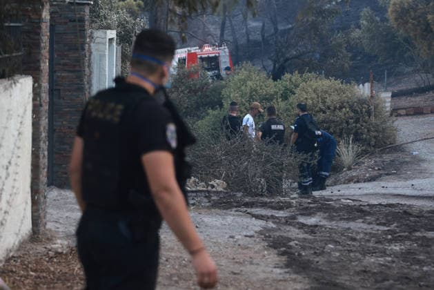 Wildfire kills 2 on Greek island of Salamina near Athens ATHENS, GREECE - AUGUST 16: Police officers stand guard near the area where two bodies were found, during a wildfire, on the island of Salamina, west of Athens, Greece, on August 16, 2026 Costas Baltas Anadolu Athens Greece. Editorial use only. Please get in touch for any other usage.  Copyright: x2026xAnadoluxCostasxBaltasx