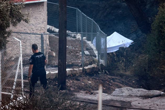 Wildfire kills 2 on Greek island of Salamina near Athens ATHENS, GREECE - AUGUST 16: Police officers stand guard near the area where two bodies were found, during a wildfire, on the island of Salamina, west of Athens, Greece, on August 16, 2026. Costas Baltas Anadolu Athens Greece. Editorial use only. Please get in touch for any other usage.  Copyright: x2026xAnadoluxCostasxBaltasx
