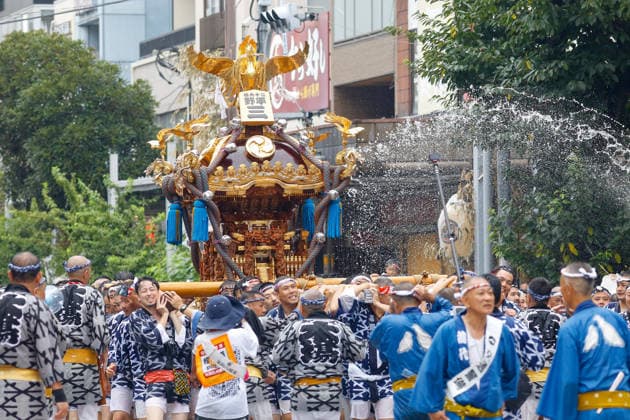 August 16, 2026, Tokyo, Japan: Participants seen carrying a heavily decorated mikoshi (portable shrine) through a cascade of splashing water in Koto Ward during the Fukagawa Hachiman Festival. The triennial festival is one of Tokyo s top three major Edo-period festivals held at Tomioka Hachimangu Shrine. It is well known as the Water-Splashing Festival (Mizukake Matsuri), where participants toss gallons of purifying water onto shrine bearers to beat the intense midsummer heat and bless the local community. Tokyo Japan - ZUMAs197 20260816_aaa_s197_064 Copyright: xRodrigoxReyesxMarinx