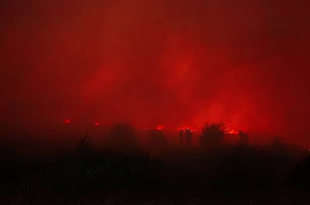 August 16, 2026, Merthyr Tydfil, GB: MERTHYR TYDFIL, WALES, UK, AUGUST 16, 2026: Firefighters from South Wales Fire and Rescue Service battle a wildfire near Dowlais Top as flames approach the Heads of the Valleys road in Merthyr Tydfil, Wales. The wildfire comes after an extended period of hot and dry weather across the United Kingdom. Merthyr Tydfil GB - ZUMAq101 20260816_zna_q101_081 Copyright: xEthanxFowlerx