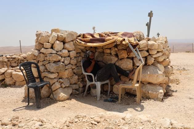 August 16, 2026, Masafer Yatta, Palestine, State of: MASAFER YATTA, WEST BANK, PALESTINE, AUGUST 16, 2026: Palestinian Abdullah Dababseh holds his phone displaying a demolition order issued by the Israeli army for the cave where he lives in Khirbet Khallet Al-Dabaa, south of Hebron. According to local residents, demolition orders were issued for three homes, three caves, a school, trees and crops in the area. Residents said the village was demolished in May 2025, forcing some Palestinians to live in caves. Masafer Yatta Palestine, State of - ZUMAq101 20260816_zna_q101_087 Copyright: xMosabxShawerx
