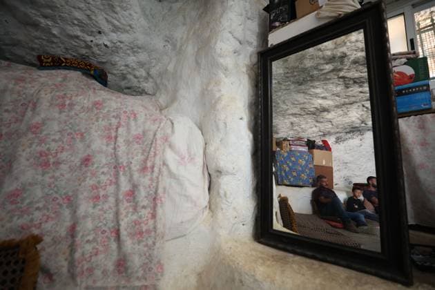 August 16, 2026, Masafer Yatta, Palestine, State of: MASAFER YATTA, WEST BANK, PALESTINE, AUGUST 16, 2026: Palestinian Abdullah Dababseh holds his phone displaying a demolition order issued by the Israeli army for the cave where he lives in Khirbet Khallet Al-Dabaa, south of Hebron. According to local residents, demolition orders were issued for three homes, three caves, a school, trees and crops in the area. Residents said the village was demolished in May 2025, forcing some Palestinians to live in caves. Masafer Yatta Palestine, State of - ZUMAq101 20260816_zna_q101_102 Copyright: xMosabxShawerx