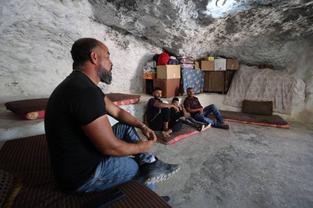 August 16, 2026, Masafer Yatta, Palestine, State of: MASAFER YATTA, WEST BANK, PALESTINE, AUGUST 16, 2026: Palestinian Abdullah Dababseh holds his phone displaying a demolition order issued by the Israeli army for the cave where he lives in Khirbet Khallet Al-Dabaa, south of Hebron. According to local residents, demolition orders were issued for three homes, three caves, a school, trees and crops in the area. Residents said the village was demolished in May 2025, forcing some Palestinians to live in caves. Masafer Yatta Palestine, State of - ZUMAq101 20260816_zna_q101_107 Copyright: xMosabxShawerx