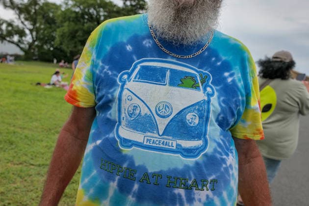 August 16, 2026, New York, New York, USA: 70s Hippie tie dye at the VW Gridlock on Governors Island. The vintage Volkswagen show returned to .the island across from the Lower Manhattan skyline. The collection of about 75 vintage epic.Volkswagens from across the years with models the Beetle, Bus, Karmann Ghia and Thing .were parked along the waterside at Picnic Point for visitors to enjoy, admire and photograph. New York USA - ZUMAh156 20260816_znp_h156_007 Copyright: xMiloxHessx