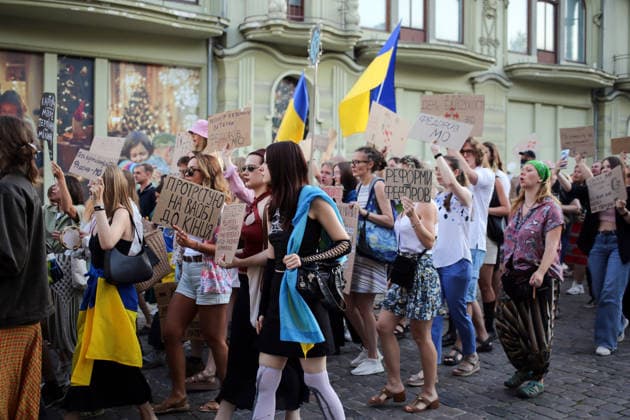 August 16, 2026, Odessa, Ukraine: Activists hold placards expressing their opinions and Ukrainian flags on during the rally Deribasovskaya Street. A march in support of former Defense Minister Fedorov passed through the central streets of Odessa. Activists are demanding that Mykhailo Fedorov should be reinstated as Defense Minister. He was dismissed a month ago by the Ukrainian president. Similar marches have taken place across Ukraine. Odessa Ukraine  - ZUMAs197 20260816_aaa_s197_219 Copyright: xViacheslavxOnyshchenkox