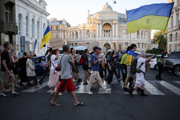 August 16, 2026, Odessa, Ukraine: Activists hold placards expressing their opinions and Ukrainian flags on during the rally Deribasovskaya Street. A march in support of former Defense Minister Fedorov passed through the central streets of Odessa. Activists are demanding that Mykhailo Fedorov should be reinstated as Defense Minister. He was dismissed a month ago by the Ukrainian president. Similar marches have taken place across Ukraine. Odessa Ukraine  - ZUMAs197 20260816_aaa_s197_220 Copyright: xViacheslavxOnyshchenkox