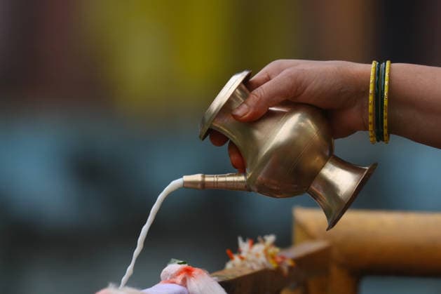 August 17, 2026, Kathmandu, Bagmati, Nepal: A devotee offers milk at a sacred pond during Nag Panchami, a Hindu festival dedicated to the worship of serpent deities. Kathmandu Nepal - ZUMAa308 20260817_znp_a308_010 Copyright: xChandraxBahadurxAlex