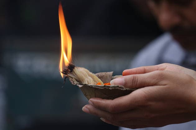 August 17, 2026, Kathmandu, Bagmati, Nepal: The Naag Panchami festival is being celebrated today with traditional worship and offerings to serpents. Observed annually on the fifth day of the bright fortnight of the month of Shrawan, this festival involves pasting images of serpents on the main entrance of homes and visiting serpent ponds (Naagdah) for worship. A woman praying to the Serpent Deity. Kathmandu Nepal - ZUMAa308 20260817_znp_a308_015 Copyright: xChandraxBahadurxAlex