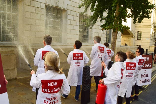 August 17, 2026, London, England, United Kingdom: Climate activists from the group Scientists On Survival spray the Department for Energy Security and Net Zero (DESNZ) in Westminster with water using fire extinguishers in protest against Rosebank, as the public consulation on the North Sea oil and gas field concludes. London United Kingdom - ZUMAv130 20260817_zip_v130_005 Copyright: xVukxValcicx
