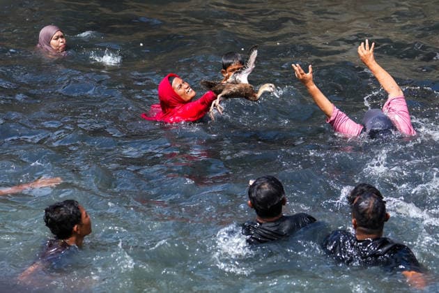 August 17, 2026, Banda Aceh, Aceh, Indonesia: Residents competed to catch ducks in the waters of the Lampaseh River in Banda Aceh, Aceh Province, Indonesia, on Monday. The competition, which involved dozens of children and adultsÃ¢â‚¬both male and femaleÃ¢â‚¬was one of the traditional games organized to celebrate the 81st anniversary of the Republic of Indonesia s independence. Banda Aceh Indonesia  - ZUMAi115 20260817_zip_i115_036 Copyright: xMuhammadxIqbalx