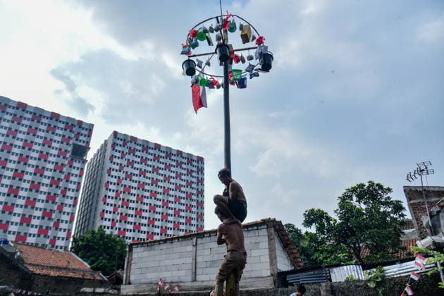 August 17, 2026, Bandung Regency, West Java, Indonesia: Participants climb a pole coated in oil and mud, with prizes placed at the top, during a competition locally known as Panjat Pinang to commemorate the 81st anniversary of the Republic of Indonesia s independence in Lengkong Village, Bandung Regency, Indonesia. Bandung Regency Indonesia - ZUMAr272 20260817_zip_r272_029 Copyright: xDimasxRachmatsyahx