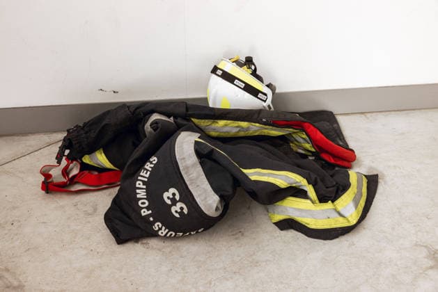 Lecornu Visits Fire-Hit Area As Residents Seek Aid - Le Porge Firefighting gear from the Sapeurs Pompiers 33 unit is displayed in Le Porge, Gironde, France on August 17, 2026, amid a gathering of wildfire victims dressed in black who had hoped to meet French Prime Minister Sebastien Lecornu after the meeting location was moved from the town hall to the fire station. Photo by Gardelle M ANDBZ ABACAPRESS.COM Le Porge Nouvelle-Aquitaine France  Copyright: xANDBZ ABACAx