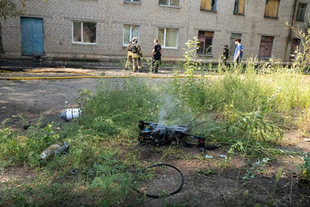 August 17, 2026, Kramatorsk, Donetsk Oblast, Ukraine: Ukrainian firefighters extinguish burning vehicles following a Russian FPV drone strike in a residential neighbourhood. The attack comes as Russia intensifies its use of drones across the Donetsk region, in Kramatorsk, Donetsk Oblast, Ukraine. Kramatorsk Ukraine  - ZUMAm350 20260817_zip_m350_024 Copyright: xCameronxJones-Manleyx