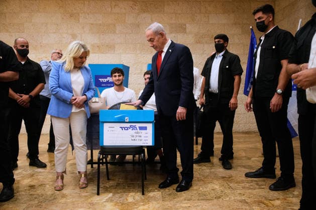 Israeli Prime Minister Benjamin Netanyahu, right, and his wife, Sara, cast their ballots in the Likud party primary elections ahead of Israel s general election in October, in Jerusalem, Monday, August 17, 2026. Pool  ERX20260817205 OhadxZwigenberg