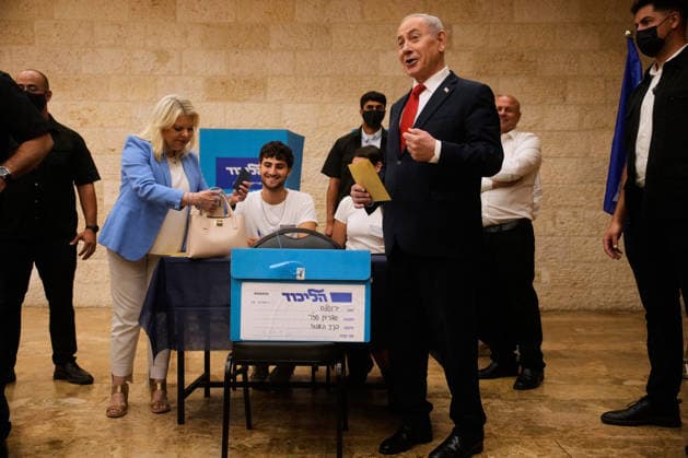 Israeli Prime Minister Benjamin Netanyahu, right, and his wife, Sara, cast their ballots in the Likud party primary elections ahead of Israel s general election in October, in Jerusalem, Monday, August 17, 2026. Pool  ERX20260817206 OhadxZwigenberg