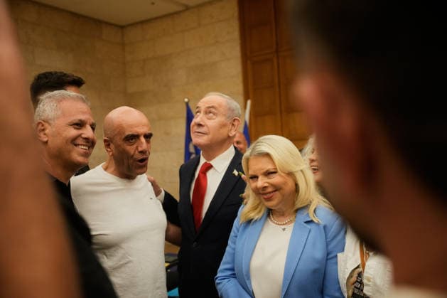 People take a selfie with Israeli Prime Minister Benjamin Netanyahu and his wife, Sara, during the Likud party primary elections ahead of Israel s general election in October, in Jerusalem, Monday, August 17, 2026. Pool  ERX20260817208 OhadxZwigenberg