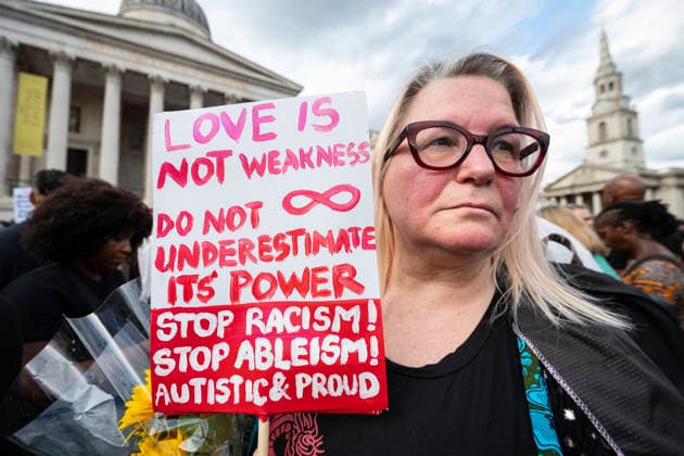 August 17, 2026, London, London, UK: LONDON, UK. A woman with a sign attends a vigil in Trafalgar Square for the late Jason Arday, the former Cambridge professor who was found dead at an address in Battersea, south London, on 14 August following his resignation as a professor of sociology of education after allegations of plagiarism and questions about some of his achievements. The vigil has been called by Stand Up to Racism who say that Ã¢â‚¬Ëœthe right-wing press, politicians and the far right subjected Arday to the most vicious racismÃ¢ London UK  - ZUMAl94_ 20260817_zaf_l94_070 Copyright: xStephenxChungx