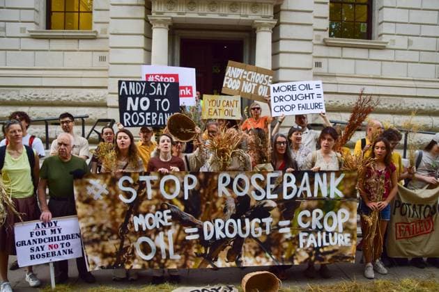 Anti-Rosebank Protests in London, UK - 17 Aug 2026 Climate activists from the group Fossil Free London hold placards and a banner opposed to fossil fuels and highlighting crop failures amidst the ongoing drought during a protest against Rosebank outside the Treasury. Two separate groups staged protests in Westminster as the public consultation on the North Sea oil and gas field concludes. London United Kingdom Copyright: xVukxValcicx xSOPAxImagesx Vuk-Valcic-1442838