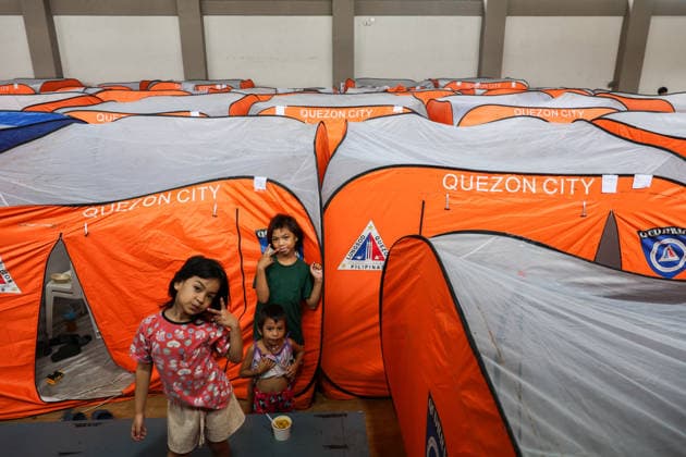 Tens of thousands evacuated in Philippines amid monsoon rains, floods QUEZON CITY, PHILIPPINES - AUGUST 18: People evacuated from flooded areas take shelter in tents at a secondary school basketball court, amid lingering threats of flooding caused by heavy monsoon rains, in Quezon City, Metro Manila, Philippines, on August 18, 2026. As the country remains threatened by floods caused by monsoon heavy rains, tens of thousands of people in the capital region of Metro Manila and its surrounding cities and areas have been evacuated, with schools in multiple locations across the Philippines being suspended for safety reasons. Daniel Ceng Anadolu Quezon City Philippines. Editorial use only. Please get in touch for any other usage.  Copyright: x2026xAnadoluxDanielxCengx