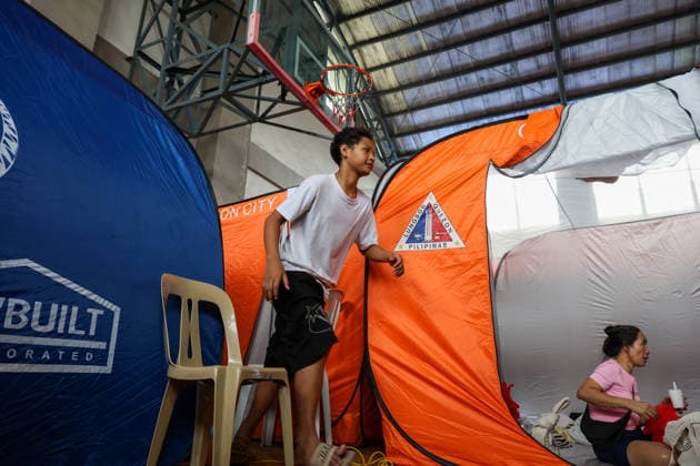 Tens of thousands evacuated in Philippines amid monsoon rains, floods QUEZON CITY, PHILIPPINES - AUGUST 18: People evacuated from flooded areas take shelter at a secondary school basketball court, amid lingering threats of flooding caused by heavy monsoon rains, in Quezon City, Metro Manila, Philippines, on August 18, 2026. As the country remains threatened by floods caused by monsoon heavy rains, tens of thousands of people in the capital region of Metro Manila and its surrounding cities and areas have been evacuated, with schools in multiple locations across the Philippines being suspended for safety reasons. Daniel Ceng Anadolu Quezon City Philippines. Editorial use only. Please get in touch for any other usage.  Copyright: x2026xAnadoluxDanielxCengx