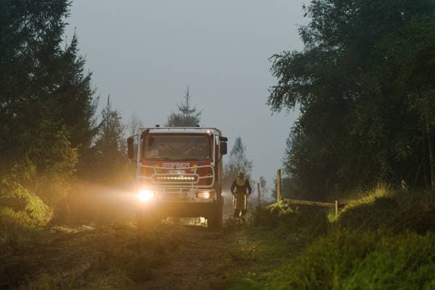Firefighters pictured in action, as a fire rages in the Hautes Fagnes (High Fens) nature reserve, on Tuesday 18 August 2026. The fire started on August 14th and 2700 hectares (on a total of 4500) are impacted.  NICOLASxLAMBERT 183633867