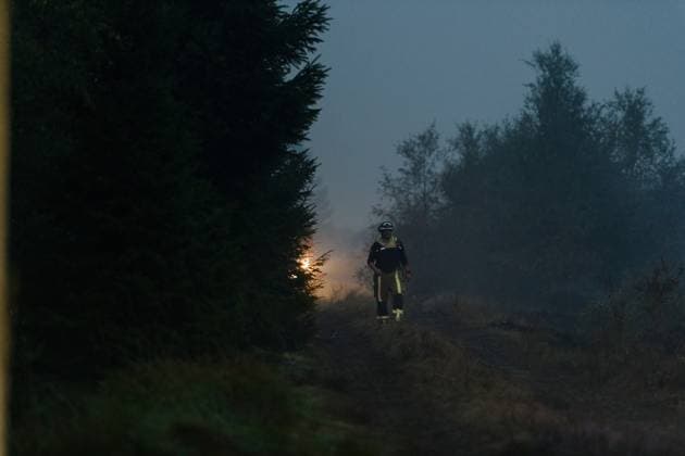 Firefighters pictured in action, as a fire rages in the Hautes Fagnes (High Fens) nature reserve, on Tuesday 18 August 2026. The fire started on August 14th and 2700 hectares (on a total of 4500) are impacted.  NICOLASxLAMBERT 183633876