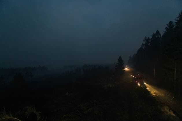 Firefighters pictured in action, as a fire rages in the Hautes Fagnes (High Fens) nature reserve, on Tuesday 18 August 2026. The fire started on August 14th and 2700 hectares (on a total of 4500) are impacted.  NICOLASxLAMBERT 183633853