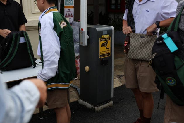 Thai schools tighten security after deadly shooting BANGKOK, THAILAND - AUGUST 18: A sign warning of a CCTV camera is seen as students queue for weapons screening before entering a school in Bangkok, Thailand, on August 18, 2026. Following a deadly school shooting on August 7, Thailand s government pledged tougher gun controls and made school safety a national priority, with schools stepping up weapons screening and other security measures. Valeria Mongelli Anadolu Banghok Thailand. Editorial use only. Please get in touch for any other usage.  Copyright: x2026xAnadoluxValeriaxMongellix