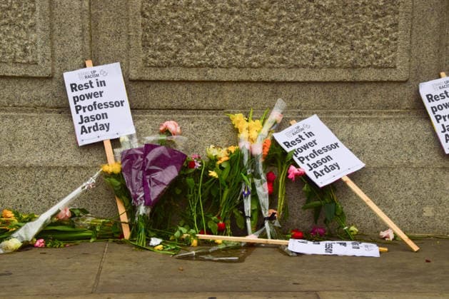August 18, 2026, London, England, United Kingdom: Floral tributes and Rest In Power placards for Jason Arday have been left at the base of Nelson s Column in Trafalgar Square following a vigil which took place the night before. The former University of Cambridge sociology professor died several days after he resigned following accusations of academic plagiarism and scrutiny of his personal claims. London United Kingdom - ZUMAv130 20260818_zip_v130_010 Copyright: xVukxValcicx
