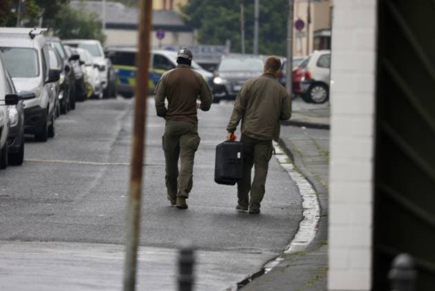 Police seal off Erlenhofstrasse in Cologne after reports of gunshots from attic COLOGNE, GERMANY - AUGUST 18: German police officers secure the cordoned-off perimeter around Erlenhofstrasse during an ongoing armed operation in the Niehl district of Cologne, Germany, on August 18, 2026. Following reports that a man fired gunshots into the air from an attic apartment, numerous police units were dispatched to the scene, shutting down Erlenhofstrasse and surrounding connecting roads to vehicular and pedestrian traffic while urging the public to avoid the area. Kadir Ilboga Anadolu Cologne Germany. Editorial use only. Please get in touch for any other usage.  Copyright: x2026xAnadoluxKadirxIlbogax