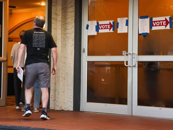 August 18, 2026, St. Petersburg, Florida, USA: The scene as the polls open with the first few people in line entering the St. Petersburg Coliseum on Primary Day on Tuesday, Aug. 18, 2026 in St. Petersburg. From left is Donna Fudge and Vivian Fueyo. St. Petersburg USA - ZUMAs70_ 20260818_zan_s70_008 Copyright: xDirkxShaddx