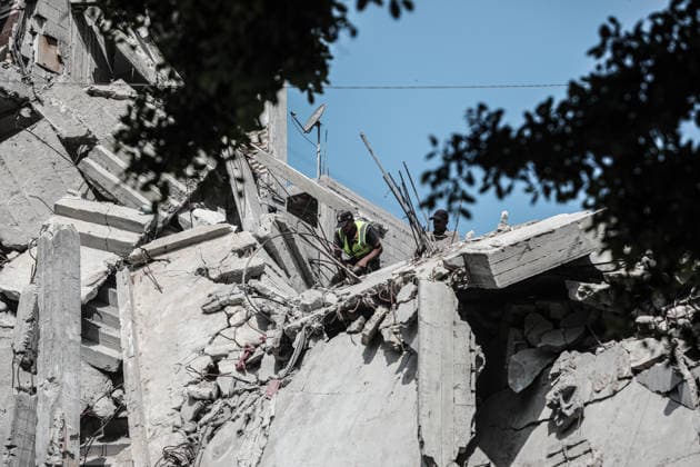 Parts of damaged buildings at risk of collapse removed using rudimentary means in Gaza GAZA CITY, GAZA, PALESTINE - AUGUST 18: Workers are viewed using rudimentary tools to remove parts and roofs of buildings heavily damaged in Israeli attacks and at risk of collapse at the Bureij Refugee Camp in the central Gaza Strip, Palestine on August 18, 2026. The removal work is being carried out by the Ministry of Public Works and Bureij Municipality in cooperation with the Qatar Committee. Amid shortages of necessary equipment due to the blockade and war, the efforts aim to reduce the danger posed by damaged structures and ensure the safety of residents. Moiz Salhi Anadolu Gaza City Gaza. Editorial use only. Please get in touch for any other usag  Copyright: x2026xAnadoluxMoizxSalhix