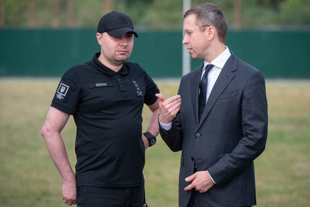 Head of the Office of the President of Ukraine Kyrylo Budanov (L) and Prime Minister of Ukraine Sergii Koretskyi participate in the solemn reburial ceremony of Colonel Yevhen Konovalets, first head of the Organisation of Ukrainian Nationalists (OUN) and colonel of the Army of the Ukrainian People’s Republic (UNR), at the National Military Memorial Cemetery in Kyiv region, Ukraine, August 18, 2026. On August 11, 2026, Konovalets’ remains were exhumed at Crooswijk General Cemetery in Rotterdam, the Netherlands, where they had rested since his assassination by a Soviet agent in May 1938. (Photo by Danylo Antoniuk Ukrinform) Remains of OUN leader Yevhen Konovalets reburied at National Military Memorial Cemetery  Copyright: xDanyloxAntoniukx