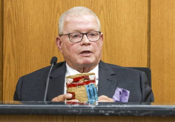 August 18, 2026, Brooksville, Florida, USA: Retired Hernando County SheriffÃ¢â‚¬â ¢s Detective Kenneth Locke holds an evidence bag containing a sock belonging to Jennifer Odom while giving testimony during the trial of Jeffrey Crum on Tuesday, Aug. 18, 2026, at the Hernando County Courthouse in Brooksville. Brooksville USA - ZUMAs70_ 20260818_zan_s70_081 Copyright: xDouglasxR.xCliffordx