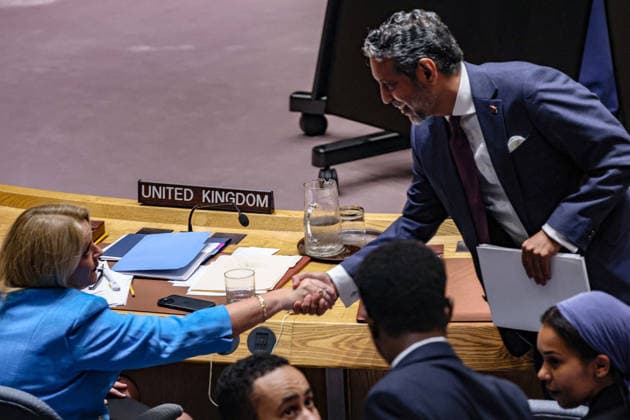 August 18, 2026, New York, New York, United States: TAHER M. EL-SONNI (R), Permanent Representative of Libya to the United Nations, shakes hands with SARAH MACINTOSH, Permanent Representative of the United Kingdom to the United Nations, following a UN Security Council meeting on the situation in Libya. The United Kingdom is a permanent member of the Security Council and serves as penholder on Libya, leading the drafting and negotiation of Council products concerning the country, at UNHQ. New York United States  - ZUMAo116 20260818_znp_o116_031 Copyright: xBiancaxOterox