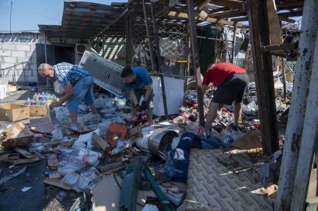 Aftermath of Russian attack in Kharkiv KHARKIV, UKRAINE - AUGUST 18: A view of destruction after the Russians fired two Banderole missiles at a cafe and a store in the center of the village of Pechenigi in the Kharkiv region in Russia, on August 18, 2026. Ten civilians were killed, and at least 18 were injured. Seven cars were burned, 15 were damaged, and 10 private homes, a post office, and five stores were damaged. Serhii Masin Anadolu Kharkiv Ukraine. Editorial use only. Please get in touch for any other usage.  Copyright: x2026xAnadoluxSerhiixMasinx